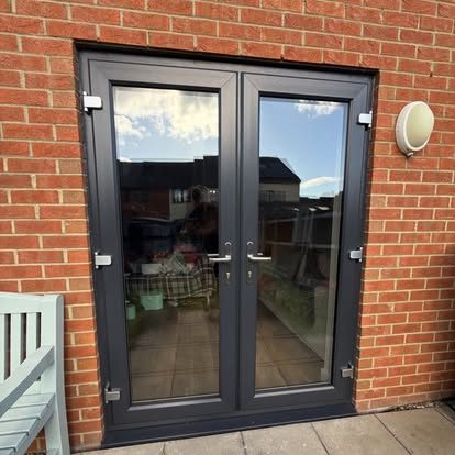 Anthracite grey REHAU French doors fitted into red brick in South Shields